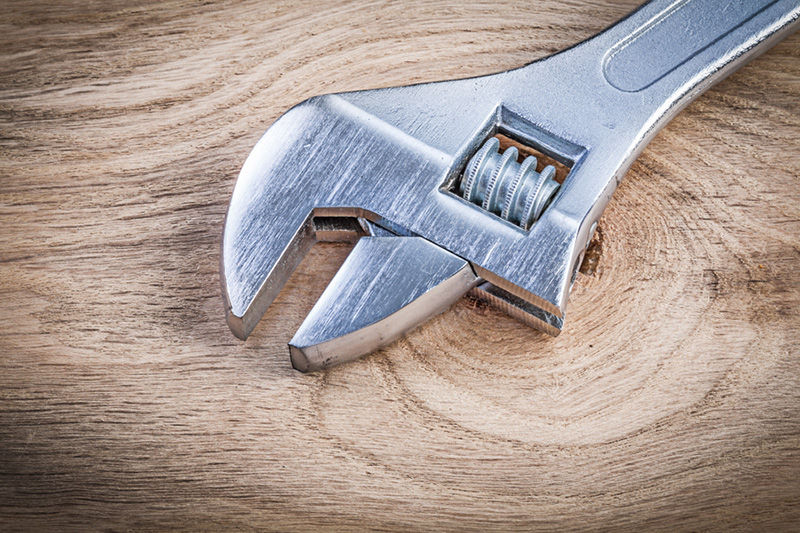 HP_A_009 1 iStock-588366138 Wrench on Wooden Table