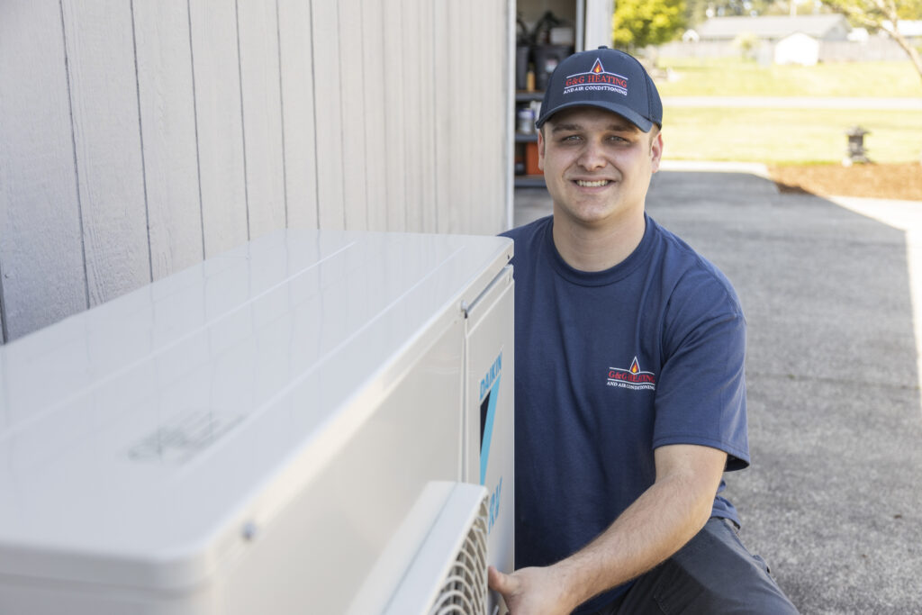 HVAC tech installing a ductless AC unit
