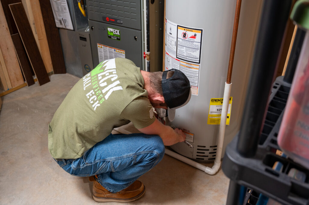 plumber working on hot water heater
